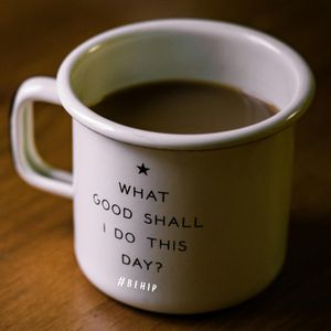 A coffee mug with the question 'What good shall I do this day?' printed on it.